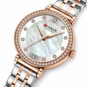 Gros plan diagonal de la montre femme bicolore Minoran 9087 argentée et rose doré