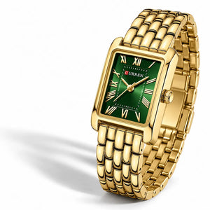Montre femme dorée Minoran 9115 à cadran vert sur fond blanc avec ombre