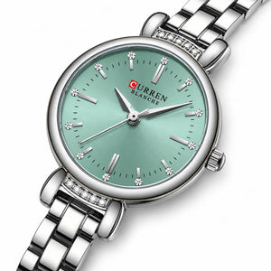 Montre ronde femme Minoran 9098, bracelet argenté et cadran vert menthe en vue trois-quarts