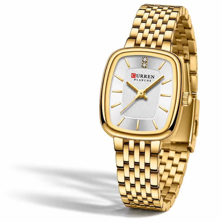Montre femme dorée Minoran 9093 posée sur un tissu blanc et photographiée de face