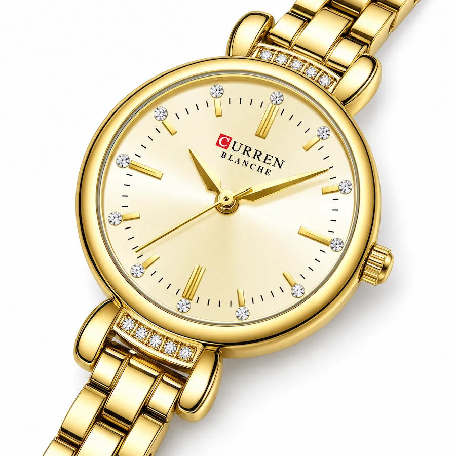 Montre Minoran 9098 dorée à cadran doré en zoom diagonal, avec index en bâtons et détails brillants