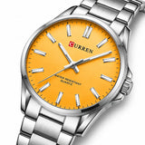 Zoom diagonal du cadran orange de la montre femme argentée Minoran 9090