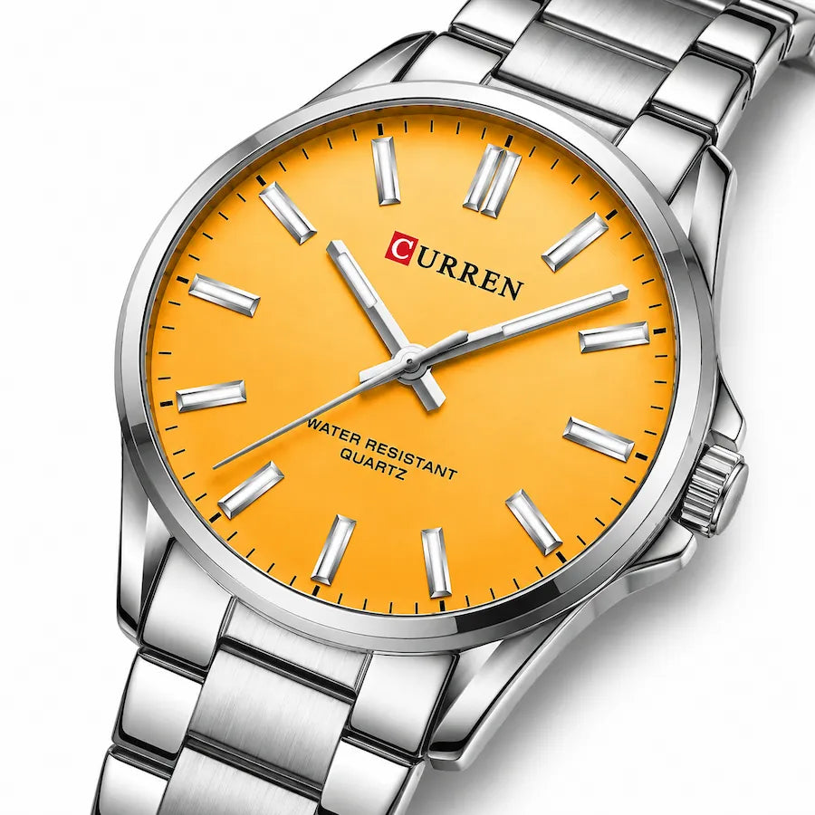 Zoom diagonal du cadran orange de la montre femme argentée Minoran 9090