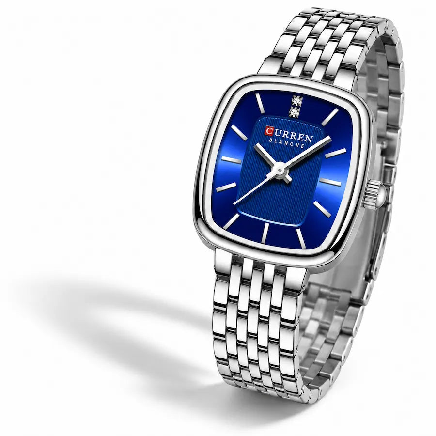 Montre femme argentée Minoran 9093 à cadran bleu sur fond blanc avec ombre
