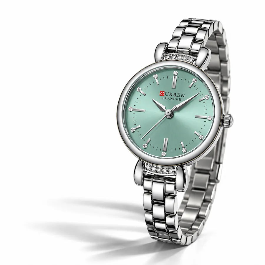 Montre femme argentée Minoran 9098 à cadran vert menthe sur fond blanc avec ombre