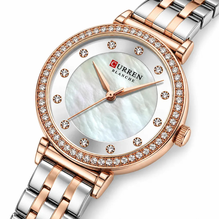 Gros plan diagonal de la montre femme bicolore Minoran 9087 argentée et rose doré