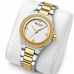 Minoran 9101 gold and silver two-tone women's watch, displayed on a white cushion