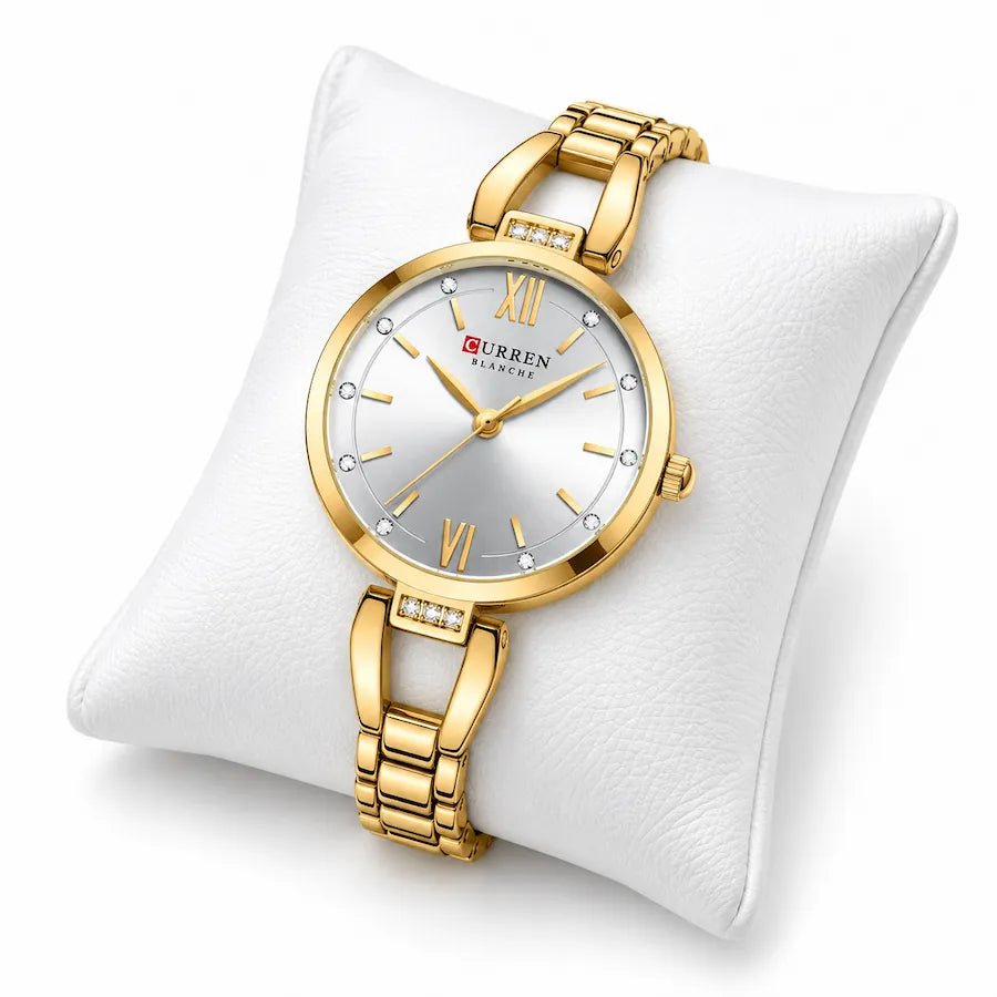 Montre dorée Minoran 9092 présentée sur un coussin blanc