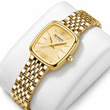 Montre femme dorée Minoran 9093 à cadran doré présentée sur un coussin blanc