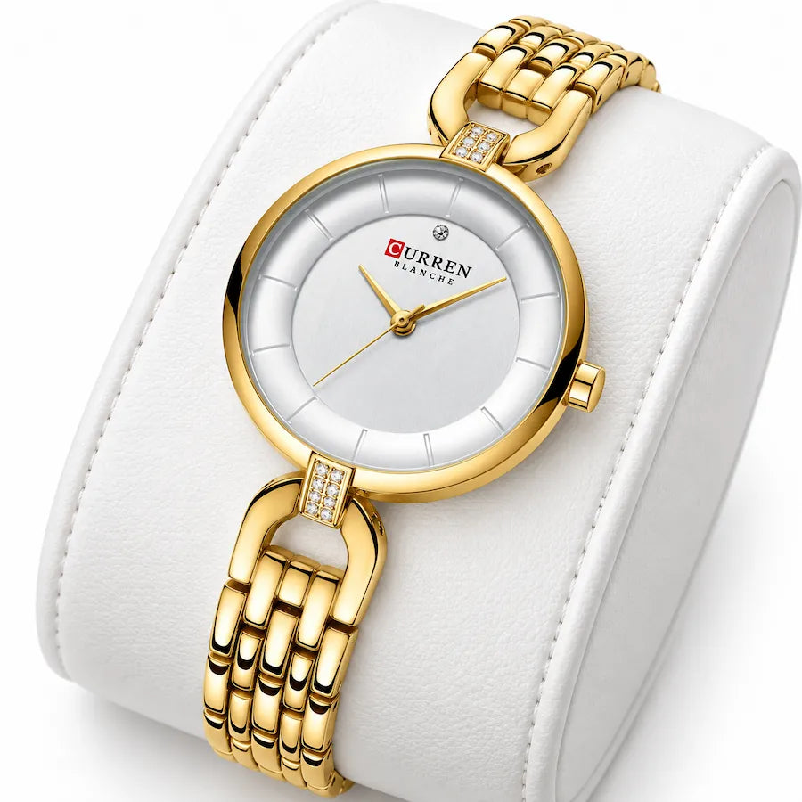 Montre femme dorée Minoran 9052 présentée sur un coussin blanc