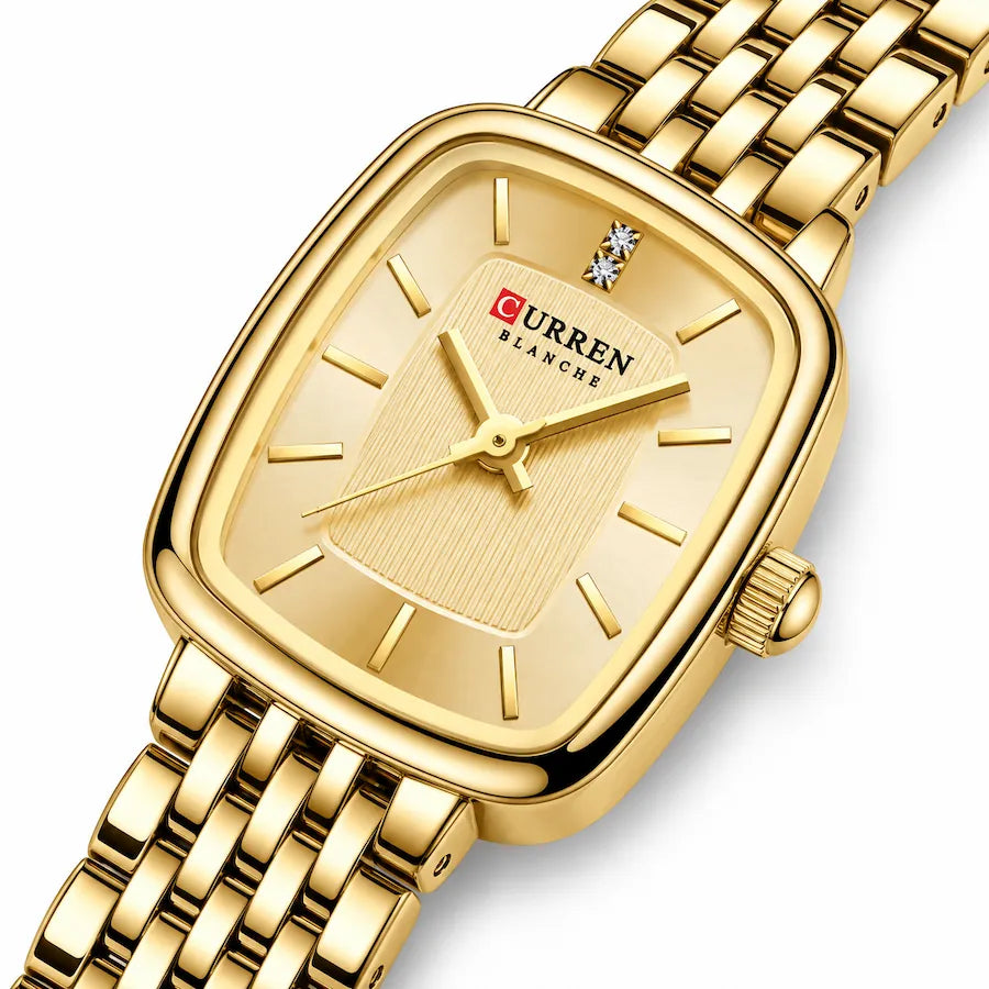 Vue rapprochée en angle de la montre femme dorée Minoran 9093 avec cadran doré rectangulaire
