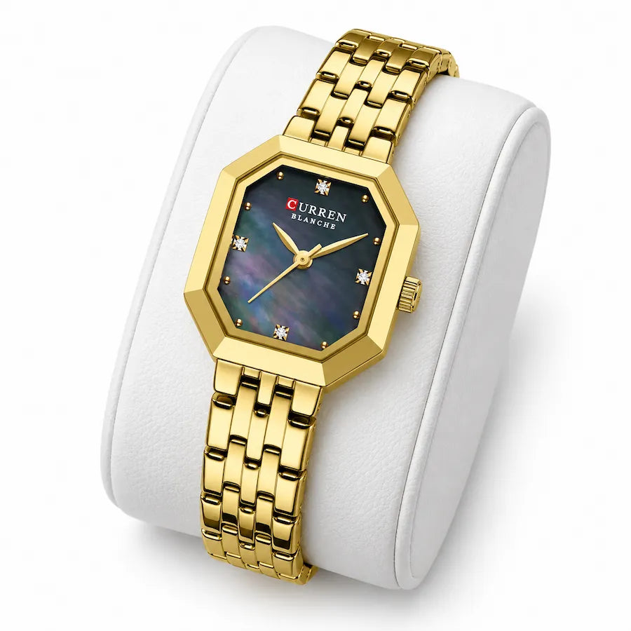 Montre femme dorée rectangulaire Minoran 9108 présentée sur un coussin blanc