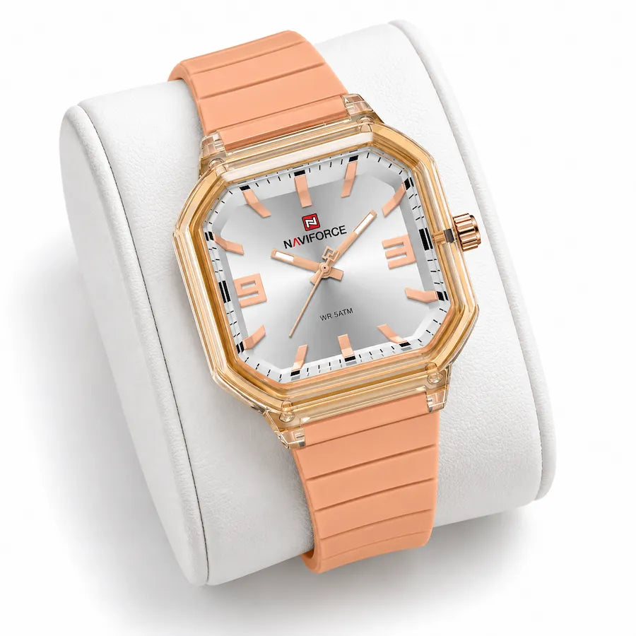 Montre Minoran NF6108, bracelet silicone pêche, cadran argenté, sur un coussin blanc