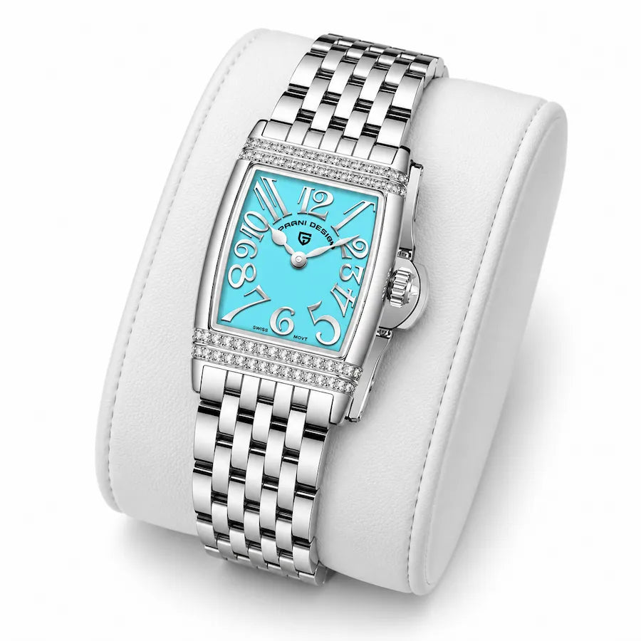 Montre Minoran PD-1737 argentée à cadran bleu posée sur un coussin blanc